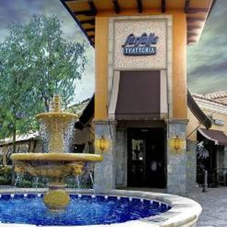 Fountain in front of "LaBelle Trattoria" restaurant entrance, featuring cascading water into a circular pool.